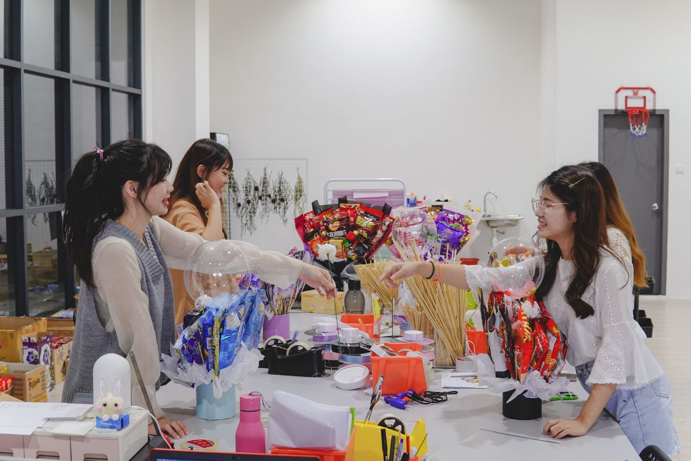 The AionNest team making snack bouquets