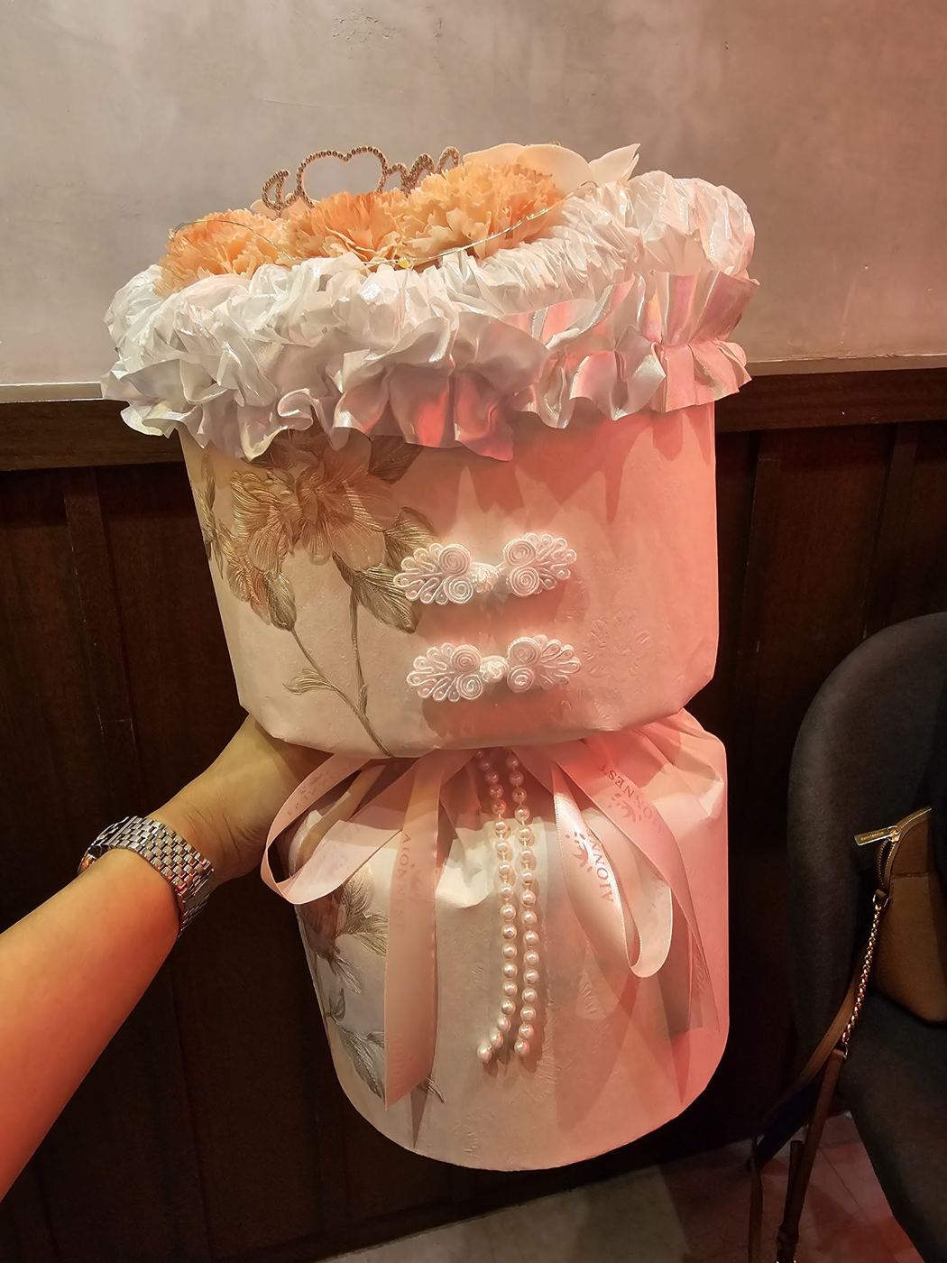 Peach carnation bouquet with pearl ribbons